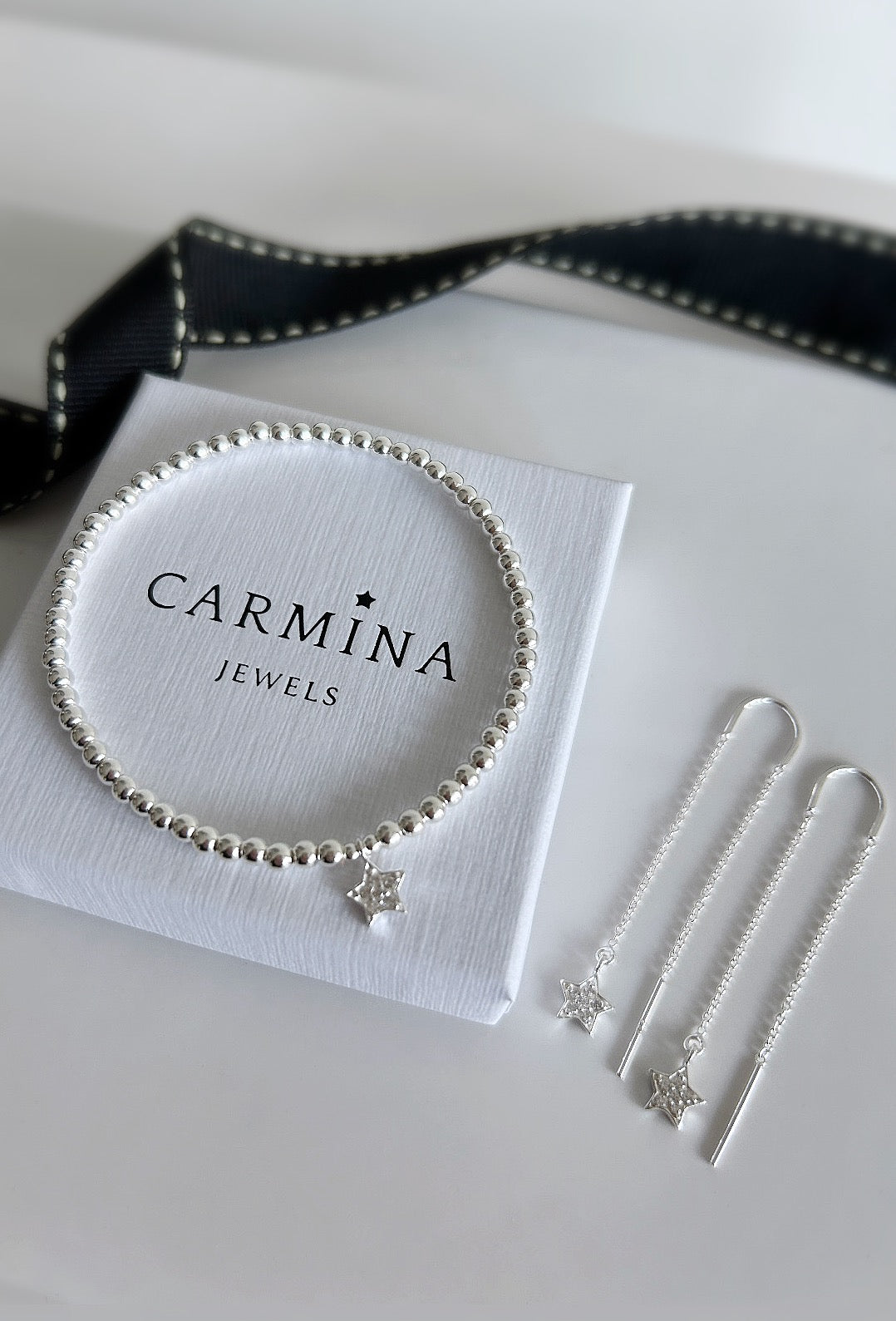 Sterling Silver CZ Star charm bracelet. This beautiful bracelet has a Sterling Silver star shaped charm, embossed with Cubic Zirconia. A perfect stacker! 