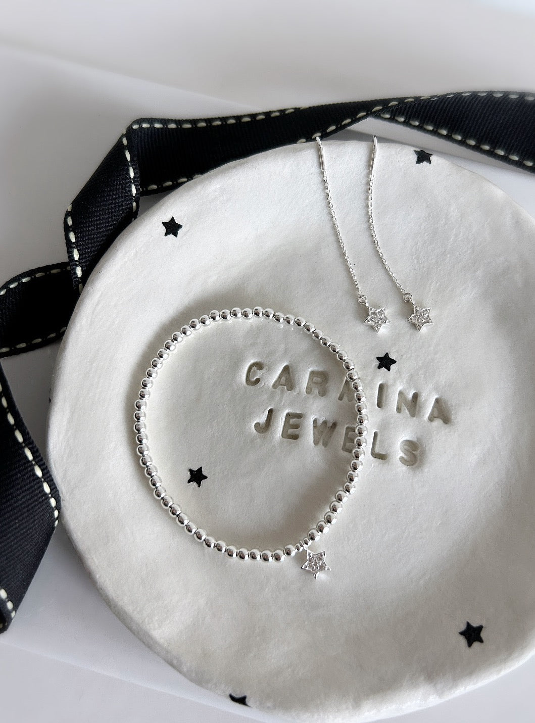 Sterling Silver CZ Star charm bracelet. This beautiful bracelet has a Sterling Silver star shaped charm, embossed with Cubic Zirconia. A perfect stacker! 