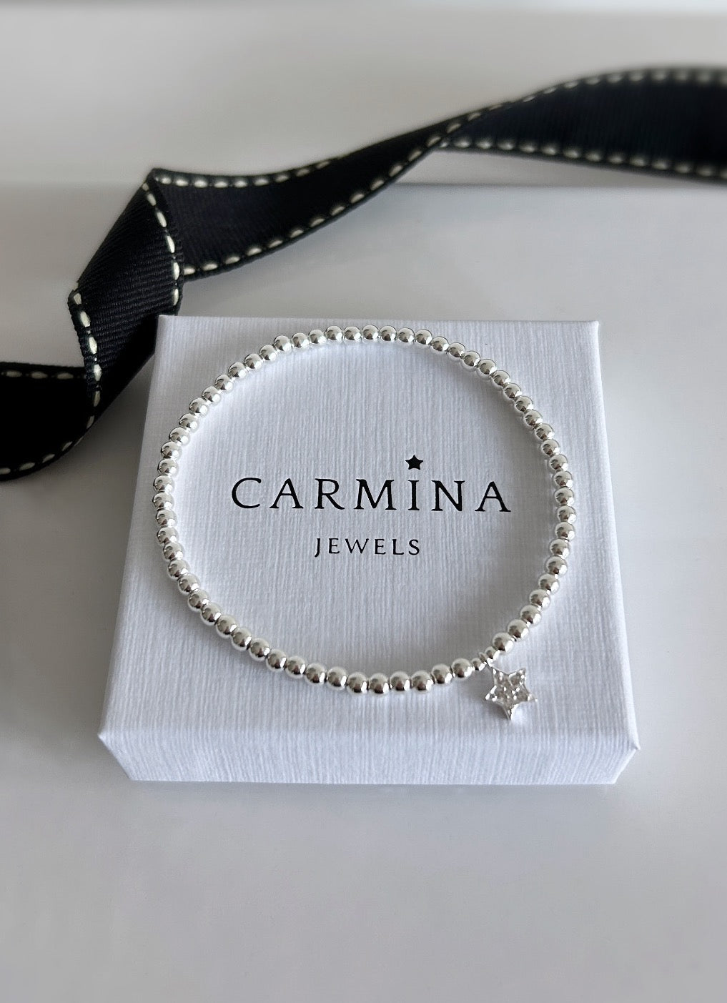 Sterling Silver CZ Star charm bracelet. This beautiful bracelet has a Sterling Silver star shaped charm, embossed with Cubic Zirconia. A perfect stacker! 