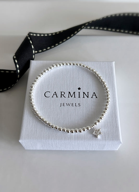 Sterling Silver CZ Star charm bracelet. This beautiful bracelet has a Sterling Silver star shaped charm, embossed with Cubic Zirconia. A perfect stacker! 