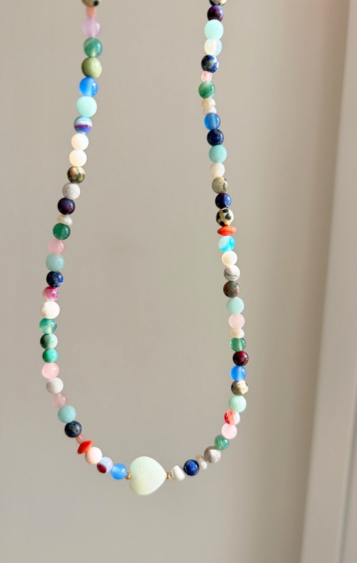 This delicious ‘Sweetie’ necklace features Semi precious beads in a glorious mix of colours, with a choice of a central Amazonite heart bead or baroque Freshwater Pearl.