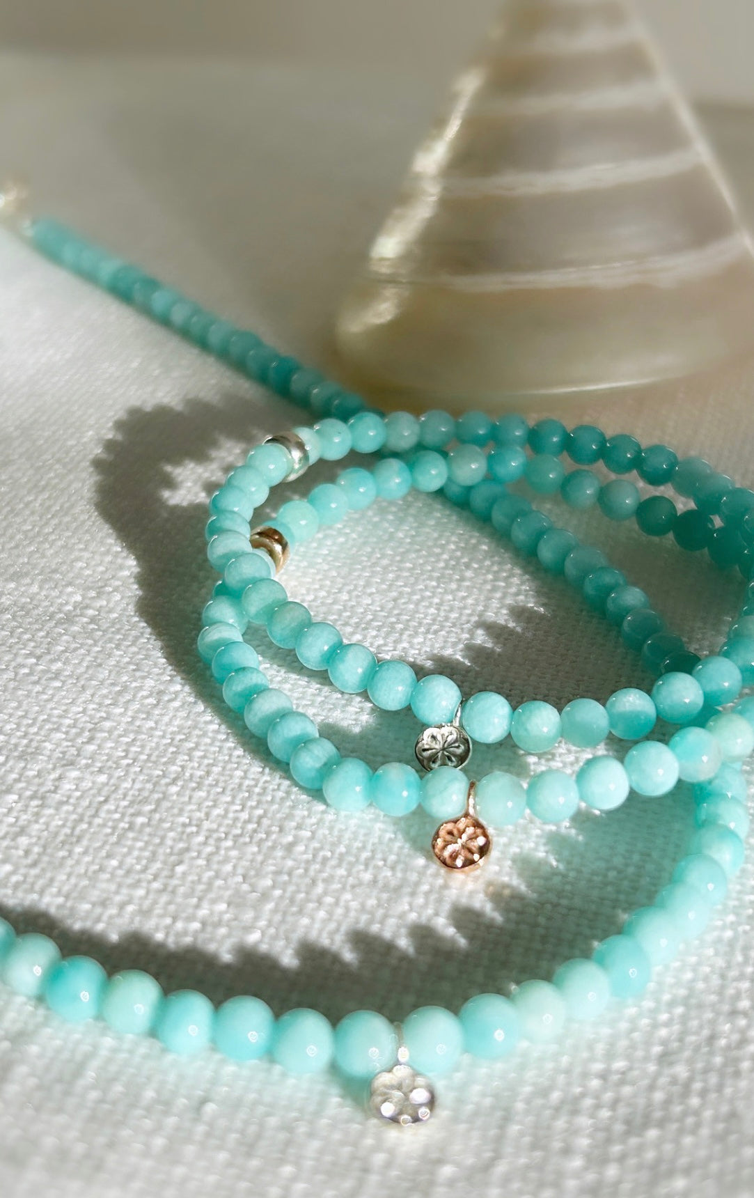 Turquoise amazonite beaded necklace With a silver charm 