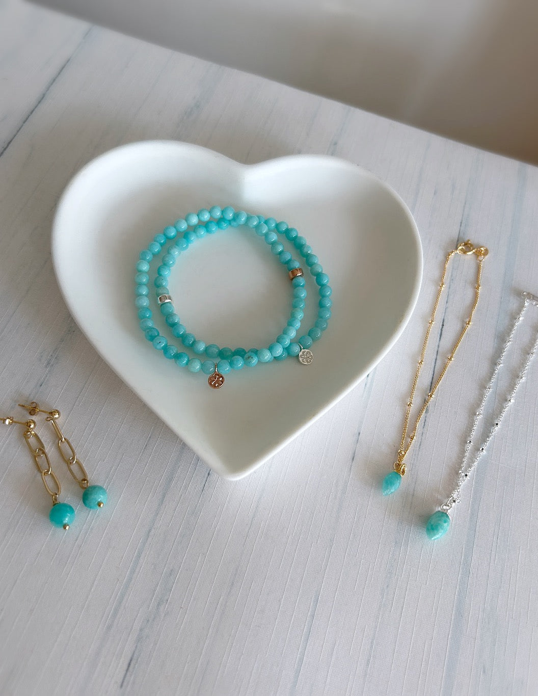 Stunning paper link chain earrings on a stud fixture with a Amazonite semi precious bead. The earrings are available in a Sterling Silver or Gold filled finish,