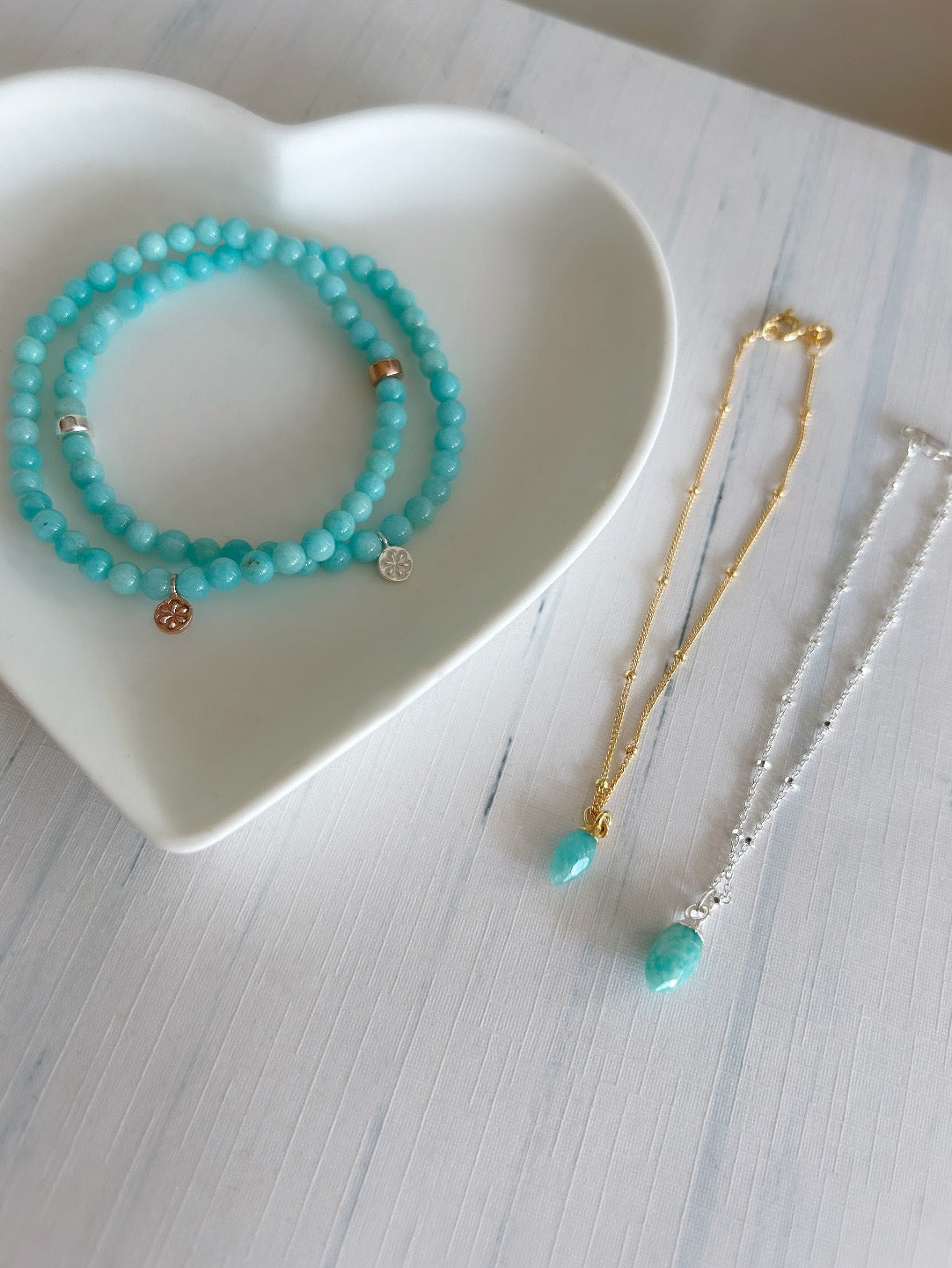 A beautiful sparkly Silver satellite chain bracelet with a semi precious Amazonite marquise droplet charm. 


