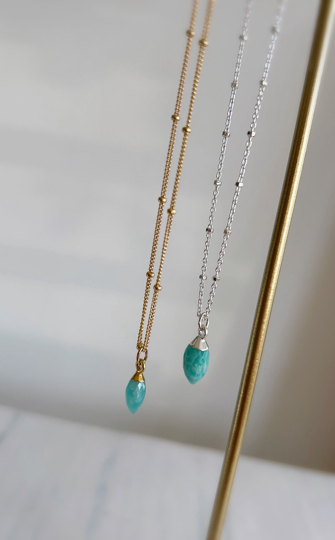 A beautiful sparkly Silver satellite chain necklace with a semi precious Amazonite marquise droplet charm. 
