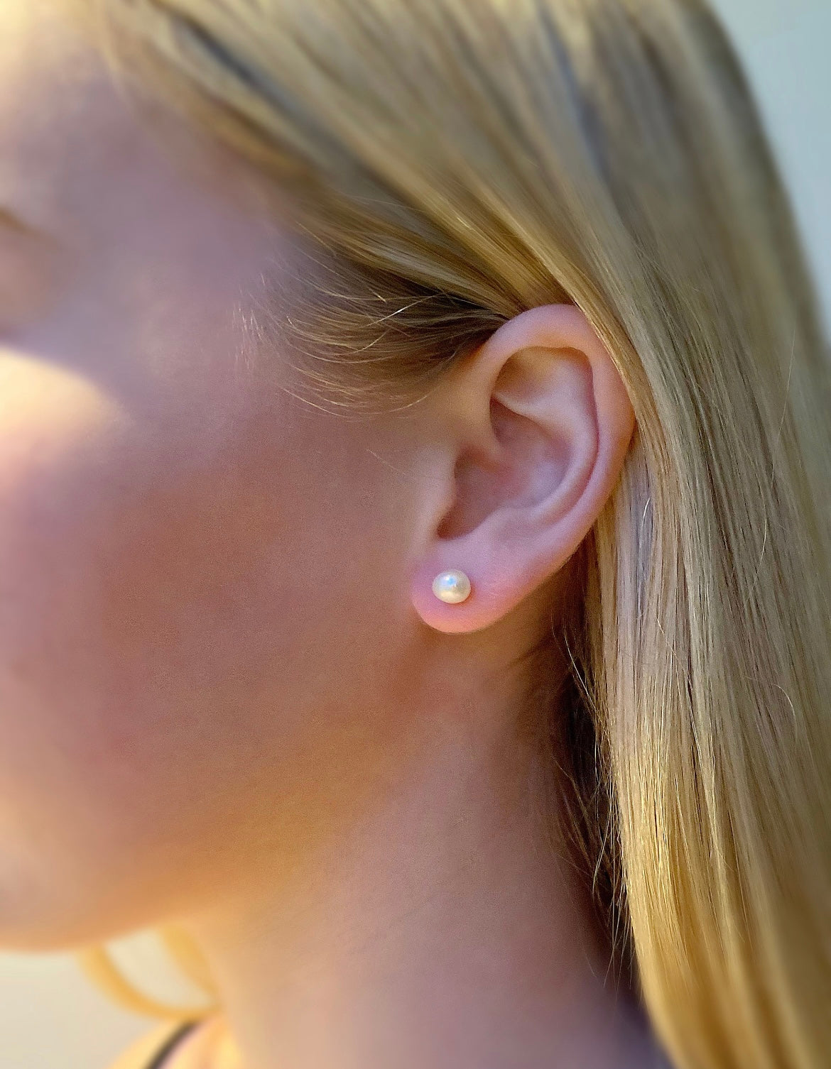 Beautiful white baroque Freshwater Pearl stud earrings on a Sterling Silver post with Silver butterfly clasps.