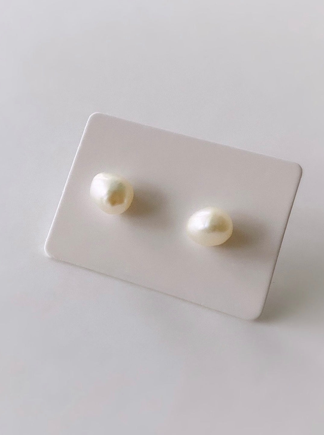 Beautiful white baroque Freshwater Pearl stud earrings on a Sterling Silver post with Silver butterfly clasps.