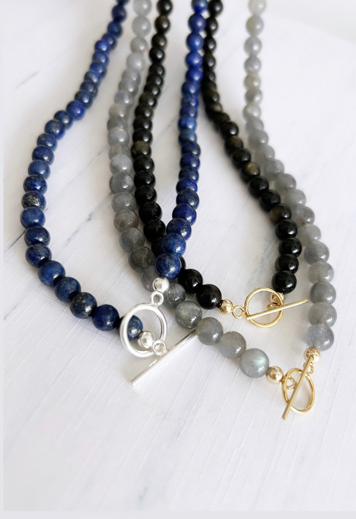 A gorgeous ‘2 in 1’ Semi Precious beaded wrap bracelet &/or necklace in a choice of either beautiful Smoky Quartz, Lapis Lazuli, Labradorite or Golden Obsidian. Finished with a delicate toggle clasp in Gold filled or Sterling Silver. 
